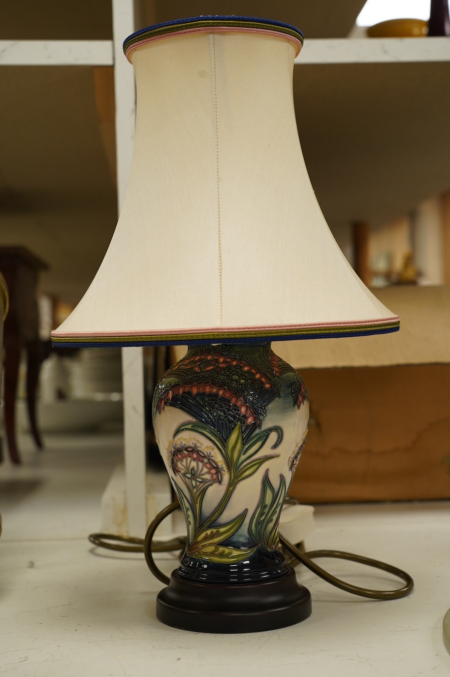 A Moorcroft lamp, shape 65/6, painter LB, with shade 37cm high. Condition - fair to good